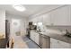 Well-appointed kitchen featuring stainless steel appliances, granite countertops, and ample cabinet space at 4153 66Th Street W Cir # 4153, Bradenton, FL 34209