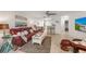 Open-concept living area with comfortable seating, tile flooring, and modern decor creates a welcoming atmosphere at 4153 66Th Street W Cir # 4153, Bradenton, FL 34209