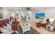 Spacious living room with tile floors, sleek furniture, and bright lighting, creating a comfortable living space at 4153 66Th Street W Cir # 4153, Bradenton, FL 34209