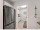 Pantry or utility area with stainless steel refrigerator and abundant storage is located just off of the kitchen at 4153 66Th Street W Cir # 4153, Bradenton, FL 34209