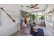 Inviting sunroom with tile flooring, bright windows, and comfortable seating, perfect for enjoying the view at 4153 66Th Street W Cir # 4153, Bradenton, FL 34209