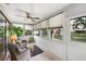 Bright sunroom with tile floor and multiple windows offering plenty of natural light and tranquil views at 4153 66Th Street W Cir # 4153, Bradenton, FL 34209