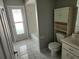Bathroom features a shower/tub, toilet, sink, and storage cabinet at 4354 Rock Creek Dr, Port Charlotte, FL 33948