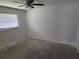 Bedroom with ceiling fan and ample natural light with floor needing repair at 4354 Rock Creek Dr, Port Charlotte, FL 33948