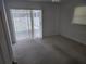 Bedroom featuring carpet flooring and sliding glass doors to the outdoor patio at 4354 Rock Creek Dr, Port Charlotte, FL 33948