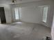 Large bedroom with carpeted floors, neutral walls, and a window seat, ready to be personalized and enjoyed at 4354 Rock Creek Dr, Port Charlotte, FL 33948