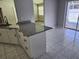 Kitchen featuring granite countertops and a sliding glass door to the pool at 4354 Rock Creek Dr, Port Charlotte, FL 33948