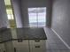 Kitchen view highlighting granite countertops and access to a sliding glass door at 4354 Rock Creek Dr, Port Charlotte, FL 33948