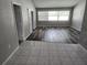 Inviting living room with warm floors, and lots of natural light, creating a comfortable and welcoming atmosphere at 4354 Rock Creek Dr, Port Charlotte, FL 33948