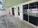 Outdoor patio with pool access from the home's back exterior at 4354 Rock Creek Dr, Port Charlotte, FL 33948