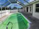 Screened-in pool provides a private and protected space to swim at 4354 Rock Creek Dr, Port Charlotte, FL 33948