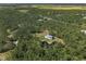 Stunning aerial view of the home and surrounding lush greenery at 4888 Old Ranch Rd, Sarasota, FL 34241