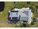 Solar home, blue car and backyard pond from an aerial drone shot at 4888 Old Ranch Rd, Sarasota, FL 34241