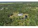 Lovely aerial shot of home with pond and lush green property at 4888 Old Ranch Rd, Sarasota, FL 34241