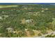 Expansive aerial view of a home nestled within a dense forest at 4888 Old Ranch Rd, Sarasota, FL 34241