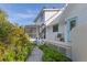 Charming backyard featuring a screened porch and lush landscaping, creating a private outdoor retreat at 4888 Old Ranch Rd, Sarasota, FL 34241