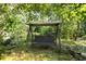 Relax and unwind on this backyard swing, surrounded by the beauty and tranquility of nature at 4888 Old Ranch Rd, Sarasota, FL 34241