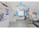 Bright bedroom with built-in bookshelves, light wood floors, and a comfortable bed, perfect for relaxation at 4888 Old Ranch Rd, Sarasota, FL 34241