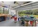 View of the garage with workspace, tables, and storage, offering a versatile area at 4888 Old Ranch Rd, Sarasota, FL 34241