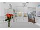 Bright kitchen and laundry room with white cabinets and countertop at 4888 Old Ranch Rd, Sarasota, FL 34241