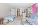 Cozy living area with daybed, comfortable seating, and French doors leading to the outdoors, creating a relaxing ambiance at 4888 Old Ranch Rd, Sarasota, FL 34241