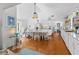 Living room featuring hardwood floors and combined kitchen and dining area at 4888 Old Ranch Rd, Sarasota, FL 34241