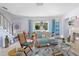 Bright and airy living room featuring a fireplace and access to a patio at 4888 Old Ranch Rd, Sarasota, FL 34241