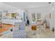 Open concept living area with kitchen, unique decor, and access to outdoor space at 4888 Old Ranch Rd, Sarasota, FL 34241