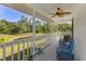 Inviting screened porch with seating offering scenic views of a tranquil river and lush greenery at 4888 Old Ranch Rd, Sarasota, FL 34241