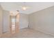 Bright room with tile floors, neutral walls, and access to the Primary bathroom at 5080 Timber Chase Way, Sarasota, FL 34238
