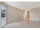 Spacious room with tile floors, ceiling fan, and access to outdoor patio through sliding glass doors at 5080 Timber Chase Way, Sarasota, FL 34238