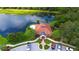 Aerial view of the Turtle Rock clubhouse with tile roof, lush landscaping, and convenient parking at 5080 Timber Chase Way, Sarasota, FL 34238
