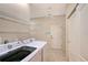 Well-equipped laundry room with washer, dryer, and convenient shelving at 5080 Timber Chase Way, Sarasota, FL 34238