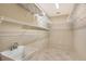Functional laundry room area with sink and ample shelving for storage at 5080 Timber Chase Way, Sarasota, FL 34238