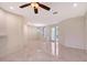 Living room with recessed lighting leads to an arched window and glass front door at 5080 Timber Chase Way, Sarasota, FL 34238