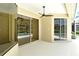 Covered patio featuring sliding glass doors and a view of the pool at 5080 Timber Chase Way, Sarasota, FL 34238