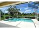 Screened in private pool with lake view, great for relaxing and entertaining outdoors at 5080 Timber Chase Way, Sarasota, FL 34238