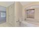 Bathroom with tiled floor, view of toilet and tub at 5124 Palm Aire Dr, Sarasota, FL 34243