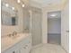 Bathroom with vanity, tiled floor, and clear glass shower stall at 5124 Palm Aire Dr, Sarasota, FL 34243