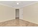 Bedroom featuring tile floors, white trim, and a doorway leading to a closet at 5124 Palm Aire Dr, Sarasota, FL 34243