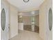 Bright foyer featuring stylish tile flooring, a view into the living area and an open floorplan at 5124 Palm Aire Dr, Sarasota, FL 34243