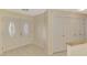 Open foyer with tile floors, a coat closet, and views into the adjacent living space at 5124 Palm Aire Dr, Sarasota, FL 34243