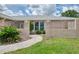 Inviting front entrance with decorative white railings and a beautifully landscaped walkway at 5124 Palm Aire Dr, Sarasota, FL 34243