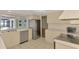 Bright kitchen featuring stainless steel appliances and view of the screened-in pool at 5124 Palm Aire Dr, Sarasota, FL 34243