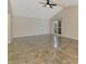 Spacious living room featuring tile floor, vaulted ceiling, and window views at 5124 Palm Aire Dr, Sarasota, FL 34243