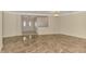 Spacious living room with elegant tile flooring and open access to the foyer, doorways and hall at 5124 Palm Aire Dr, Sarasota, FL 34243