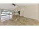 Bright living room with access to the pool area through sliding glass doors, offering indoor-outdoor living at 5124 Palm Aire Dr, Sarasota, FL 34243