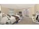 Bedroom featuring carpet, neutral tones, and a sliding glass door with access to the backyard at 5124 Palm Aire Dr, Sarasota, FL 34243