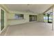Covered patio has a ceiling fan, serving counter and a sliding door at 5124 Palm Aire Dr, Sarasota, FL 34243