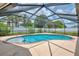 Refreshing pool with screened enclosure, well-maintained yard and privacy fence at 5124 Palm Aire Dr, Sarasota, FL 34243
